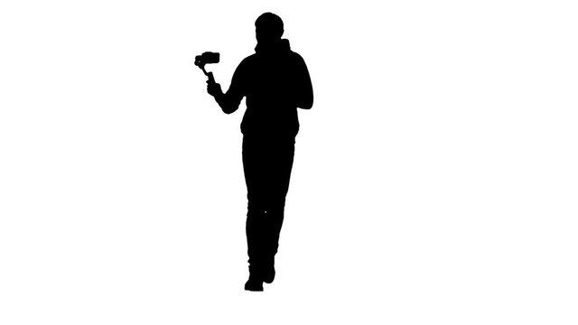 Man's silhouette producing video while running using steadicam and smartphone.