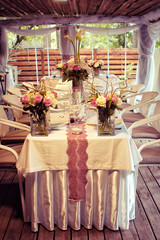  Wedding decorations. Rings on textiles, decorations with fresh flowers, candles, catering. Stylish holiday atmosphere