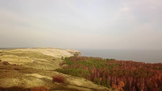 Aerial flight in Autumn over Sand Dunes in Curonian Spit Lithuania