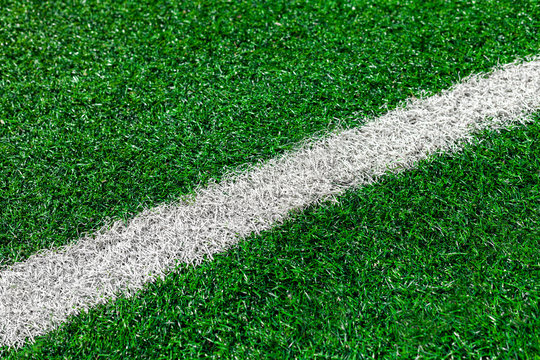 Painted White Line Of Green Artificial Turf On Soccer Field.