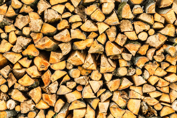 Woodpile. Firewood stacked in a woodpile. Birch wood at close range
