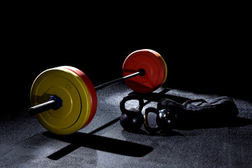 Bumper plates in gym with dramatic lighting - 267157156