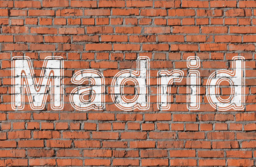 Madrid. Inscription on the seamless brickwall.