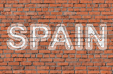 Spain. Inscription on the seamless brickwall.