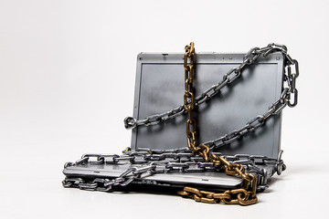 laptop computer in chains security danger  antivirus stealing data password protection concept