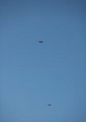2 biplanes against a blue sky