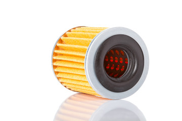 Car filter microfiber paper lying on side with reflection, isolated spare part on a white background no label.