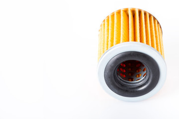 car paper filter assy oil  on a white background with empty copy space for text, close up of the car spare part.