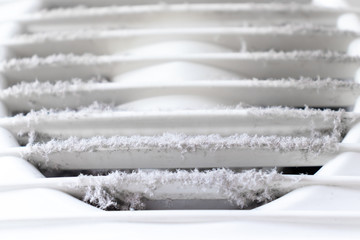 Extremely dirty and dusty white plastic ventilation air grille at home close up, harmful for health