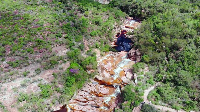 Riachinho Waterfall at Chapada Diamantina. Palmeiras, Bahia, Brazil. Drone slowly moving up 4K