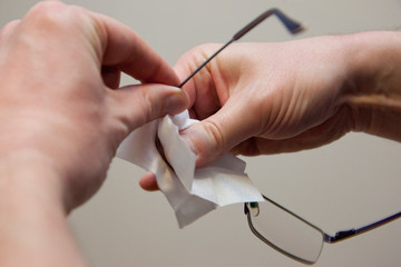 Obraz na płótnie Canvas Hand cleaning glasses