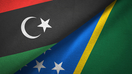 Libya and Solomon Islands two flags textile cloth, fabric texture