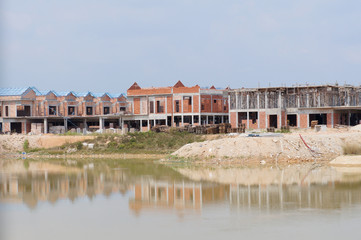 Obraz premium Double story luxury terrace house under construction in Malaysia. Designed by an architect with a modern and contemporary style. 