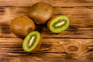 Ripe kiwi fruits on a wooden table