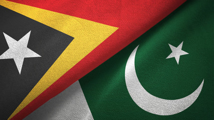Fototapeta premium East Timor and Pakistan two flags textile cloth, fabric texture