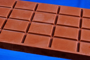 Chocolate popular food, aromatic confection, sweet treat, made from cocoa beans, sugar powder and butter of cocoa beans — the seeds of the chocolate tree tropical.
