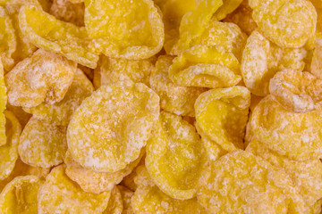 Background of the many yellow cornflakes. Healthy eating