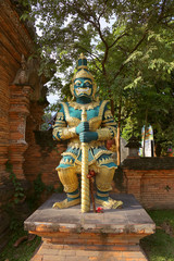 Thailand Buddhist temple yak guardian green.jpg