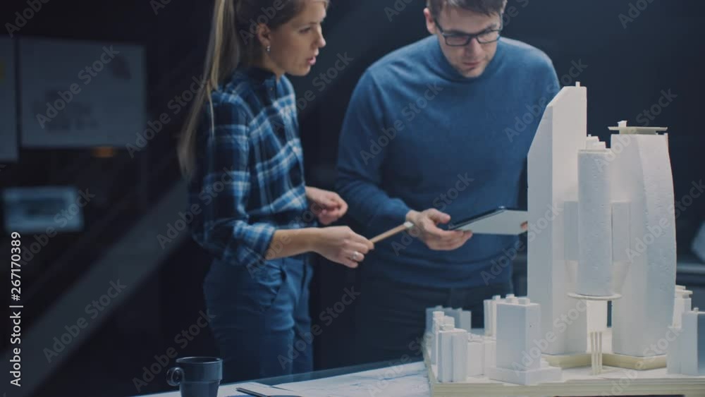 Leinwandbilder in the creative architectural bureau two professional engineers work on a model of a city district. 