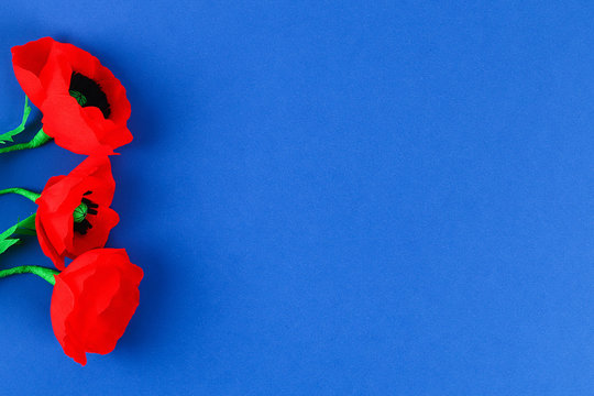 Diy Paper Red Poppy Anzac Day, Remembrance, Remember, Memorial Day Crepe Paper On Blue Background.