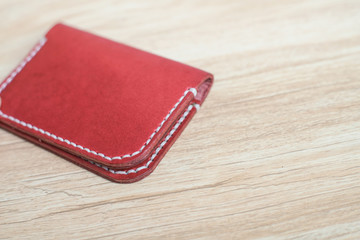 Red brown leather card holder on wood