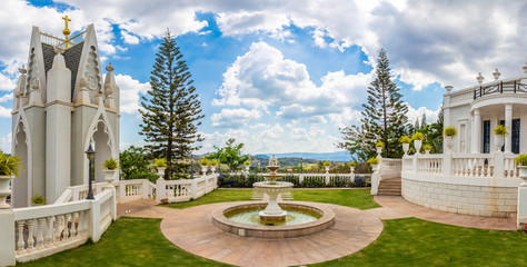 Fountain multi-tiered roman style decoration in the park with beautiful landscape background