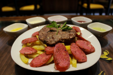 steak with french fries and hot dog