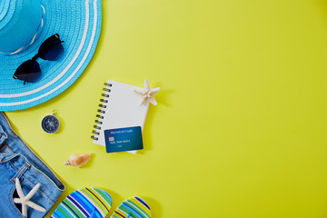 Flat lay yellow summer travel concept background