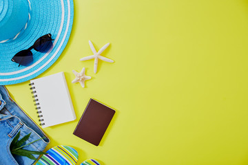 Flat lay yellow summer travel concept background