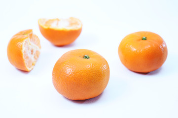 Fresh orange, cut orange and slices as background from top view