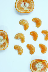 Isolated orange, Collection of whole orange or clementine fruits and peeled segments