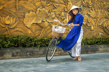 Young asian woman in traditional vietnamese dress ao dai