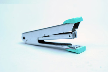 Office stationary Gray stapler with pile of staples