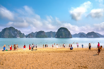 Halong bay, Vietnam - April 3rd, 2019: Tourists swimming, exploring around beach in Ti Top...