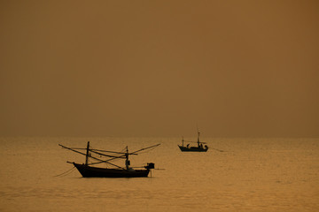 View of boat floating over the sea with sunrise