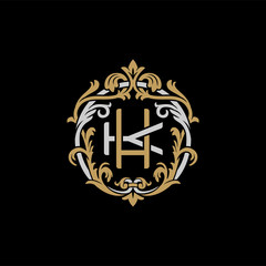 Initial letter K and H, KH, HK, decorative ornament emblem badge, overlapping monogram logo, elegant luxury silver gold color on black background