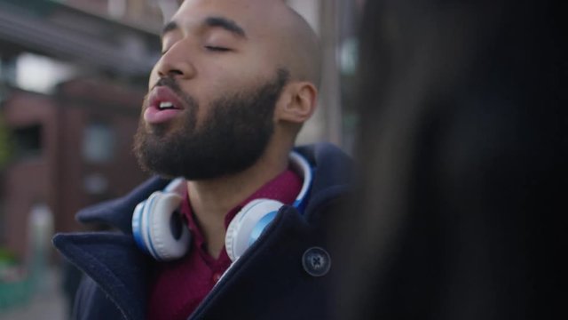 Young couple having an argument in the city 