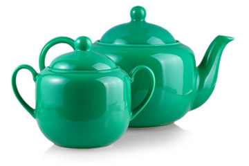 The green teapot and sugar bowl on white