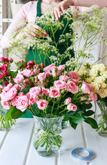 Florist working with roses.
