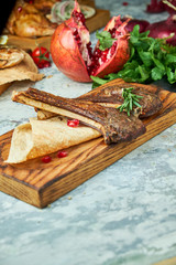 Fototapeta na wymiar Wooden board with meat from a barbecue,