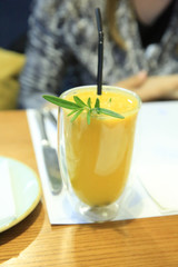 sea-buckthorn tea with ginger,Orange sbiten in a glass cup. Traditional Russian drink with honey