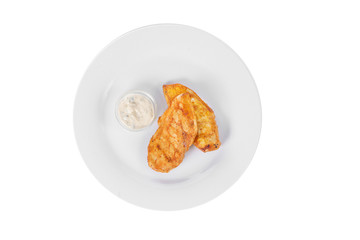 Steak from chicken, pork, grilled meat, barbecue, with tartar, sour cream, mayonnaise, white sauce on plate isolated white background, view from above
