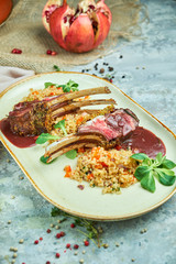 grilled lamb chops and risotto on a plate 