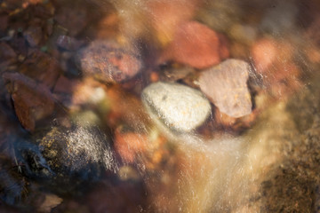 Obraz premium Flowing Water over Fluvial Material - Rocks