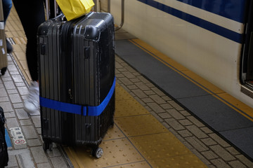 Tourist with luggage travel in train station