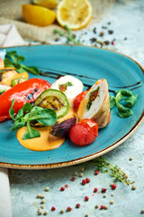 chicken roll stuffed with spices with grilled vegetables 