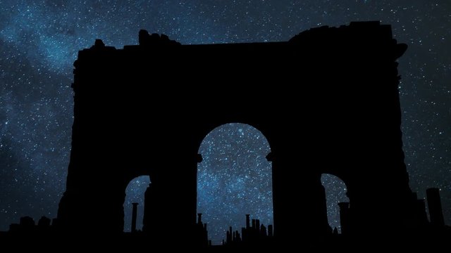 Trajan's Arch in the ruins of Timgad, Night with Stars and Milky Way, Roman-Berber city founded by the Emperor Trajan, Algeria
