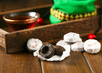 Chinese traditional pu erh tea in plate and tea cup