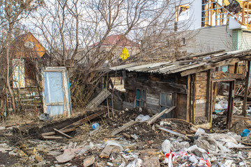 The destruction of the walls of the old building and the cleaning of construction debris with a...