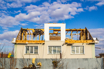 The destruction of the walls of the old building and the cleaning of construction debris with a...